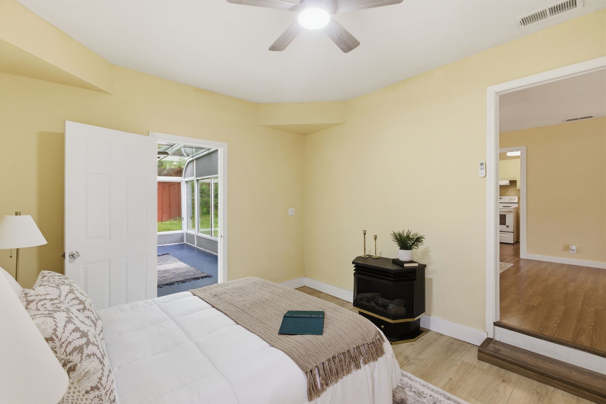 113 Mae Circle Dickson, TN 37055 - Photo 13 of 30 a bedroom with a bed and a chandelier