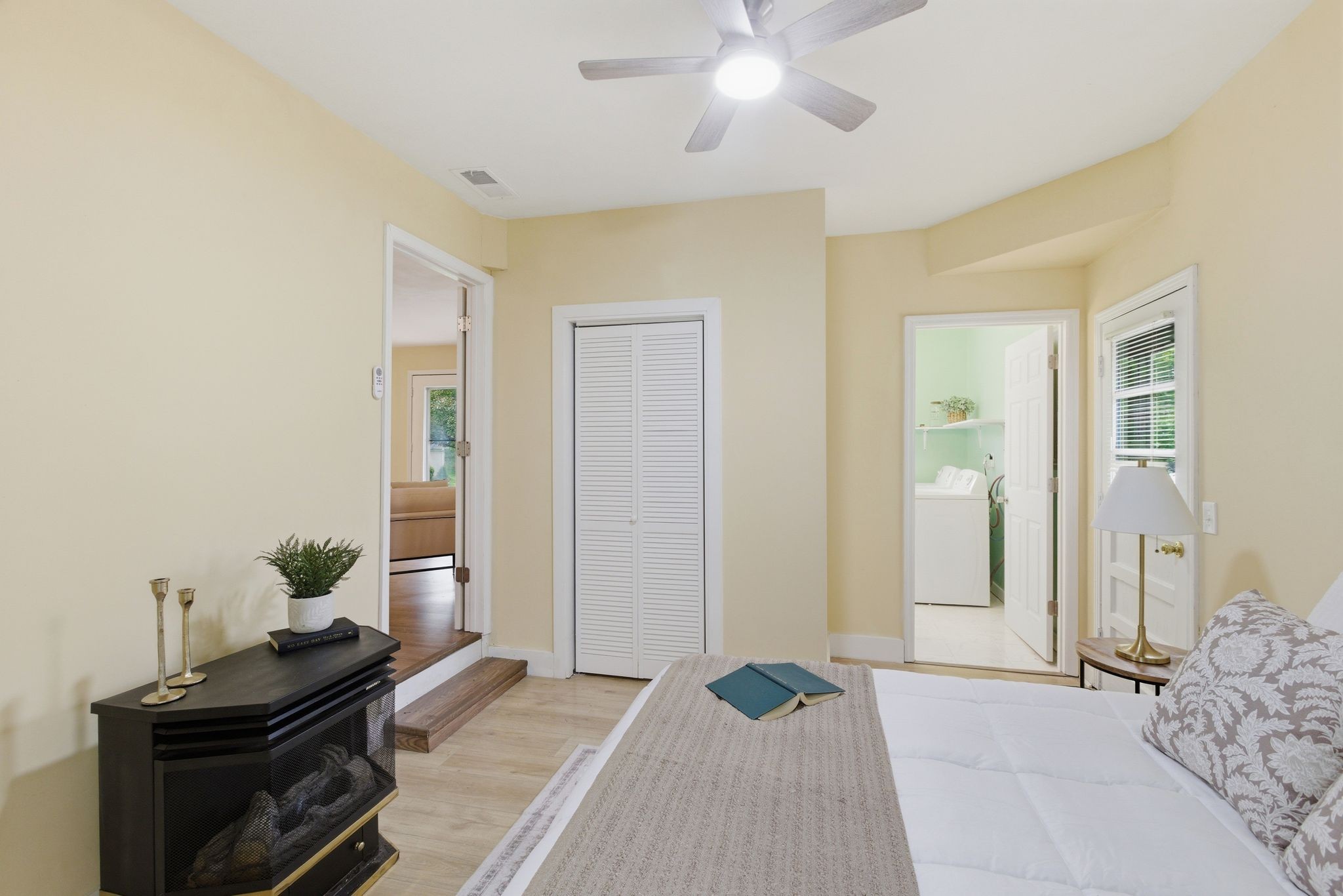 113 Mae Circle Dickson, TN 37055 - Photo 14 of 30 a bedroom with a bed and a chandelier