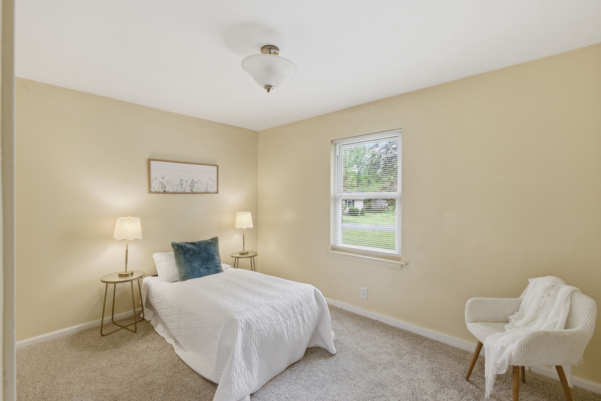 113 Mae Circle Dickson, TN 37055 - Photo 22 of 30 a bedroom with a bed and chair