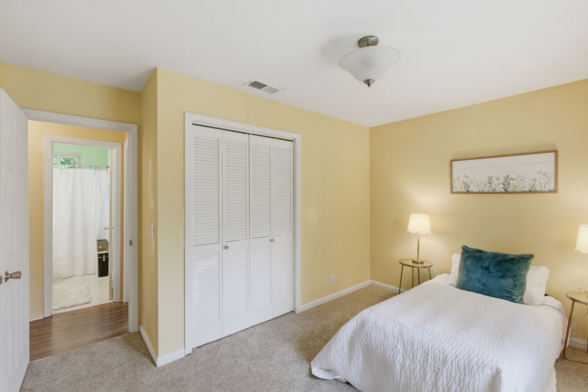 113 Mae Circle Dickson, TN 37055 - Photo 23 of 30 a bedroom with a bed and a painting on the wall