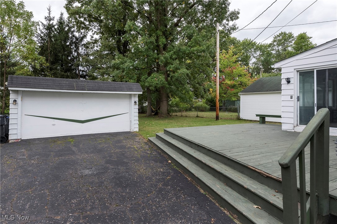 33716 Baldwin Road Solon, OH 44139 - Photo 36 of 40 Wooden terrace featuring a garage and an outbuilding