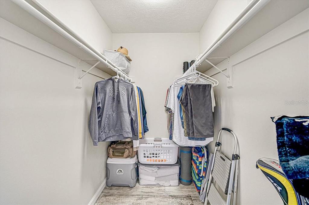 1624 Stickney Point Road, Unit 1624301 Sarasota, FL 34231 - Photo 21 of 55 a view of walk in closet with clothes