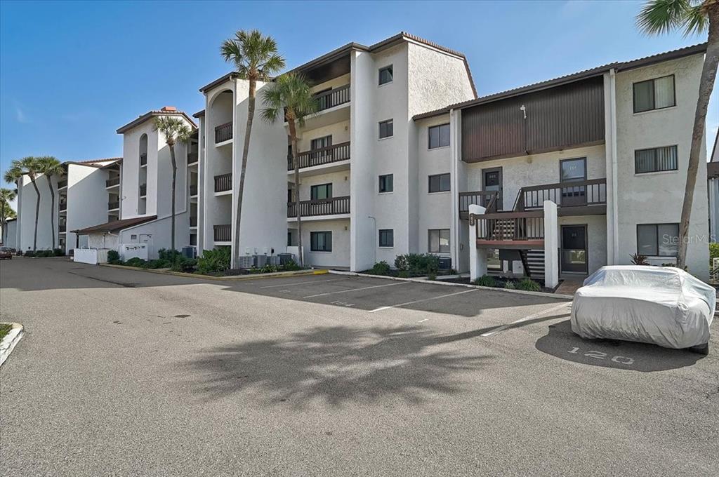 1624 Stickney Point Road, Unit 1624301 Sarasota, FL 34231 - Photo 28 of 55 a tall building sitting on the side of a street