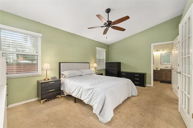 a bathroom with a double vanity sink mirror and toilet
