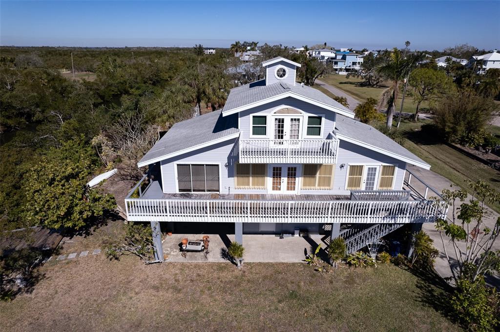 145 Burns Road Terra Ceia, FL 34250 - Photo 39 of 65 an aerial view of a house with a yard