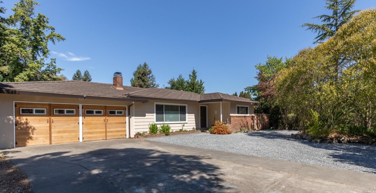 276 Brey Road Santa Rosa, CA 95409 - Photo 1 of 1 a front view of a house with a yard and a garage