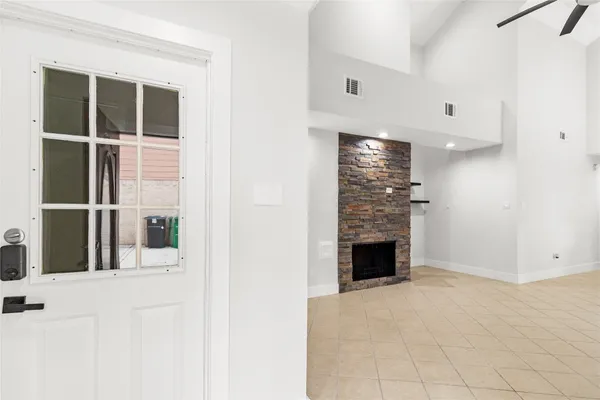 a view of a living room with a fireplace