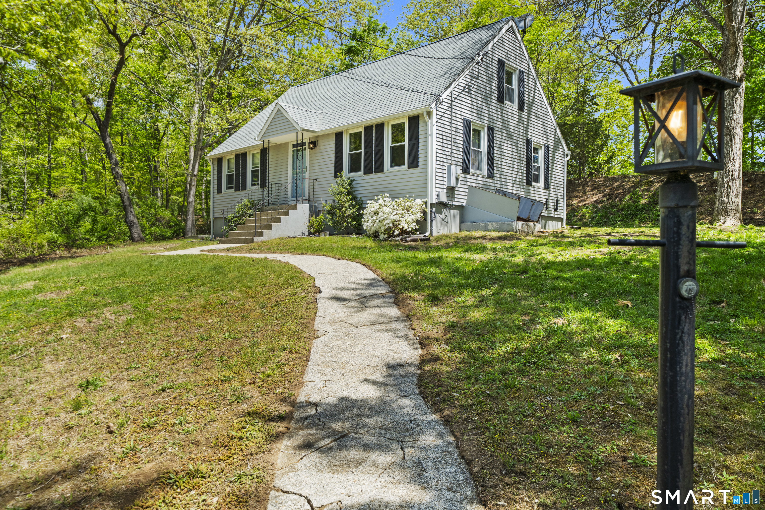 14 Church Street Sprague, CT 06330 - Photo 2 of 36 a front view of a house with garden
