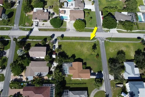 an aerial view of multiple houses with outdoor space