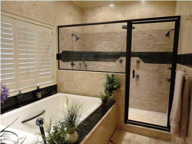 7404 San Ramon Drive Milton, FL 32583 - Photo 14 of 24 Travertine walls and flooring!! spa shower!
