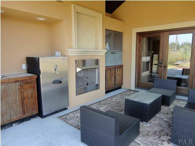 7404 San Ramon Drive Milton, FL 32583 - Photo 21 of 24 Backyard oasis! Fireplace, sink, refrigerator and view!