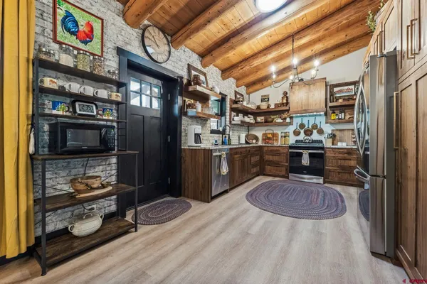 a view of a house with backyard and entertaining space