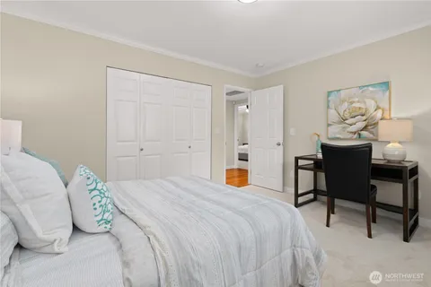 a bedroom with a bed and a table in it