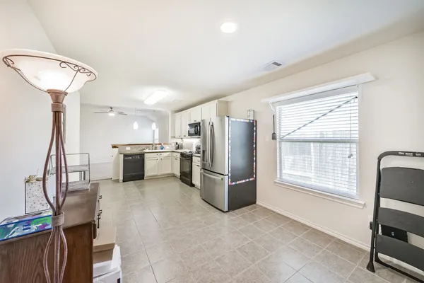 a view of storage and utility room with racks on the wall