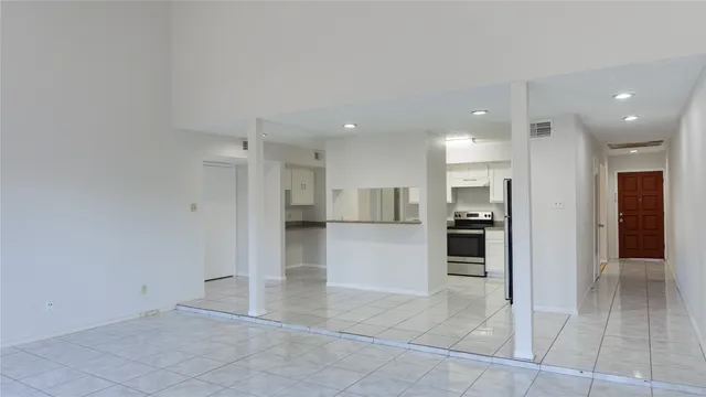 a view of kitchen with refrigerator and kitchen