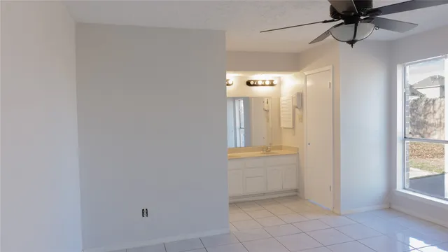 an empty room with windows and entrance