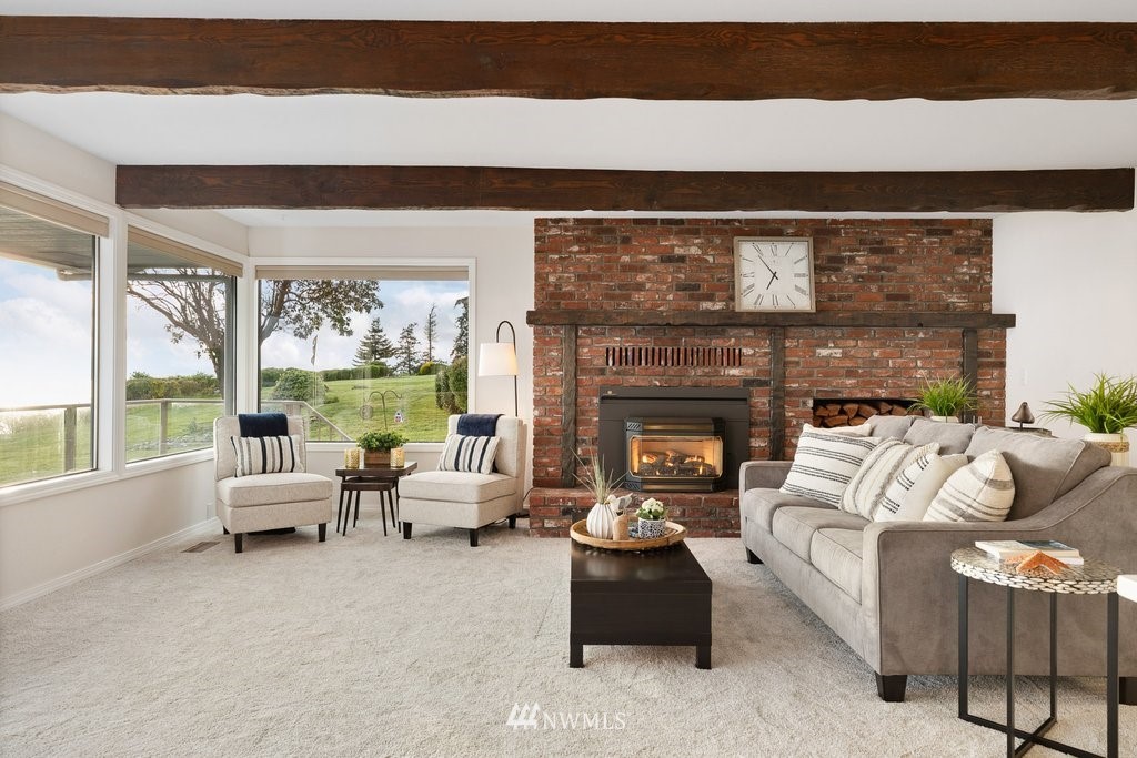 3082 Mount Baker Circle Oak Harbor, WA 98277 - Photo 17 of 40 a living room with furniture and a fireplace