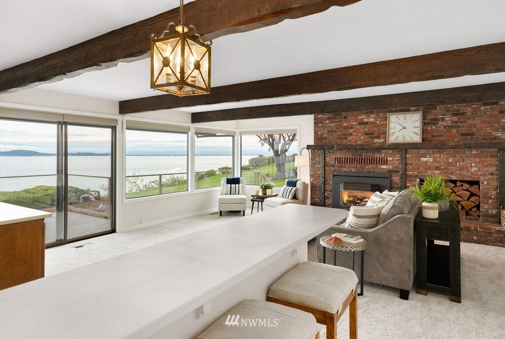 3082 Mount Baker Circle Oak Harbor, WA 98277 - Photo 18 of 40 a living room with furniture and a floor to ceiling window