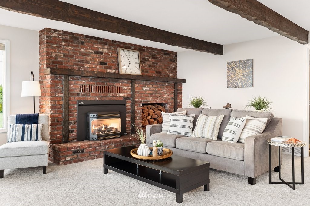 3082 Mount Baker Circle Oak Harbor, WA 98277 - Photo 19 of 40 a living room with furniture and a fireplace
