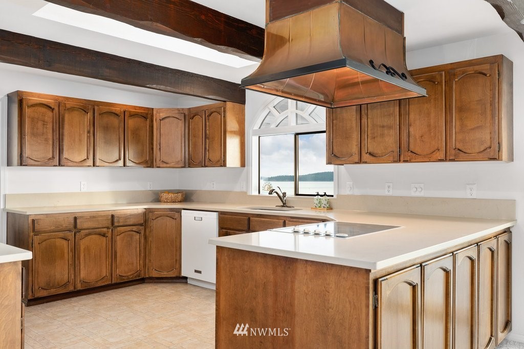 3082 Mount Baker Circle Oak Harbor, WA 98277 - Photo 22 of 40 a kitchen with stainless steel appliances granite countertop a sink and a white cabinets