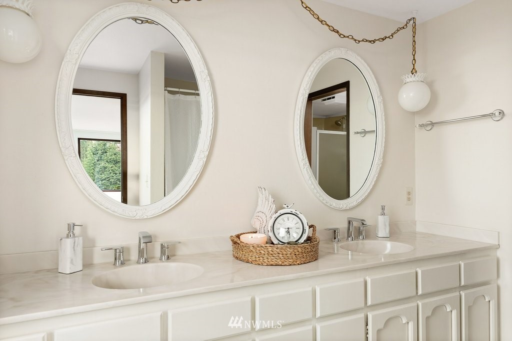 3082 Mount Baker Circle Oak Harbor, WA 98277 - Photo 27 of 40 a bathroom with a granite countertop double vanity sinks and a mirror