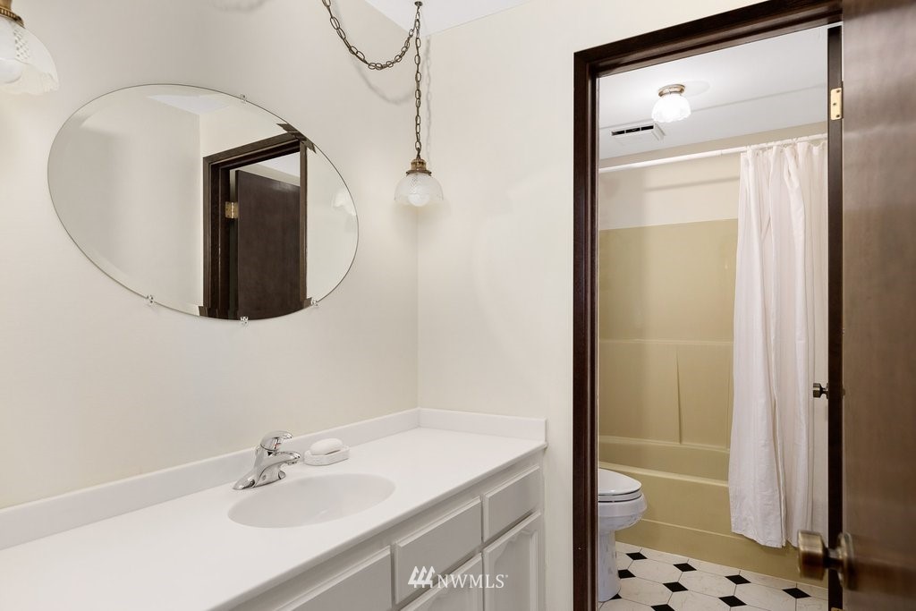 3082 Mount Baker Circle Oak Harbor, WA 98277 - Photo 28 of 40 a bathroom with a sink a toilet and shower