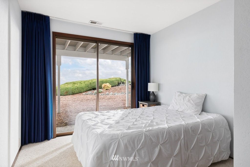 3082 Mount Baker Circle Oak Harbor, WA 98277 - Photo 29 of 40 a bedroom with a bed and a large window