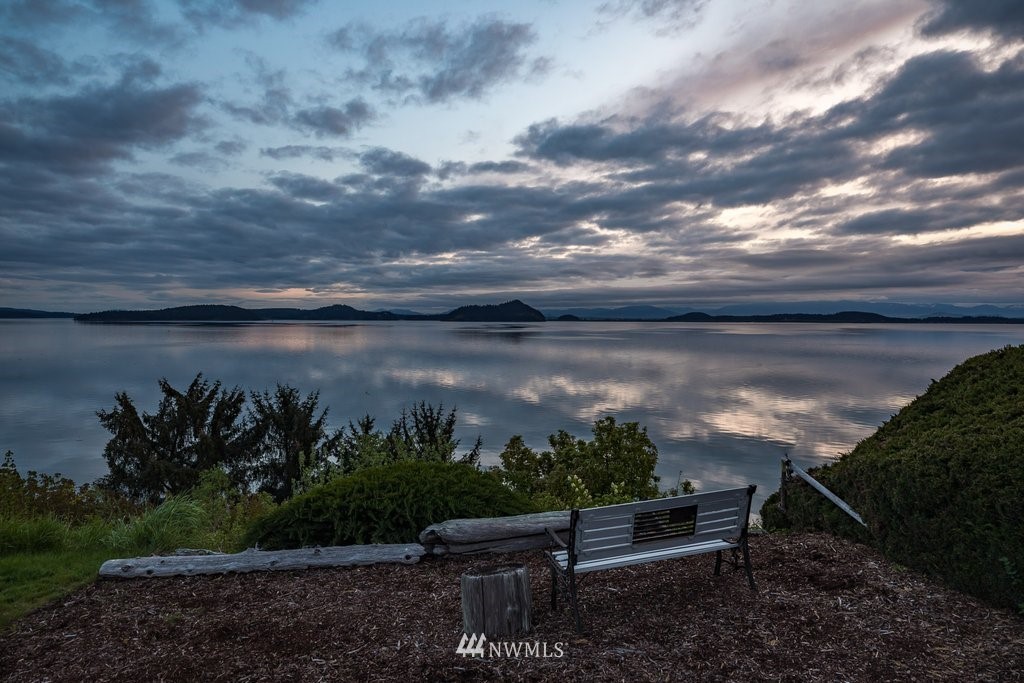 3082 Mount Baker Circle Oak Harbor, WA 98277 - Photo 7 of 40 a view of a bench in the backyard of a lake
