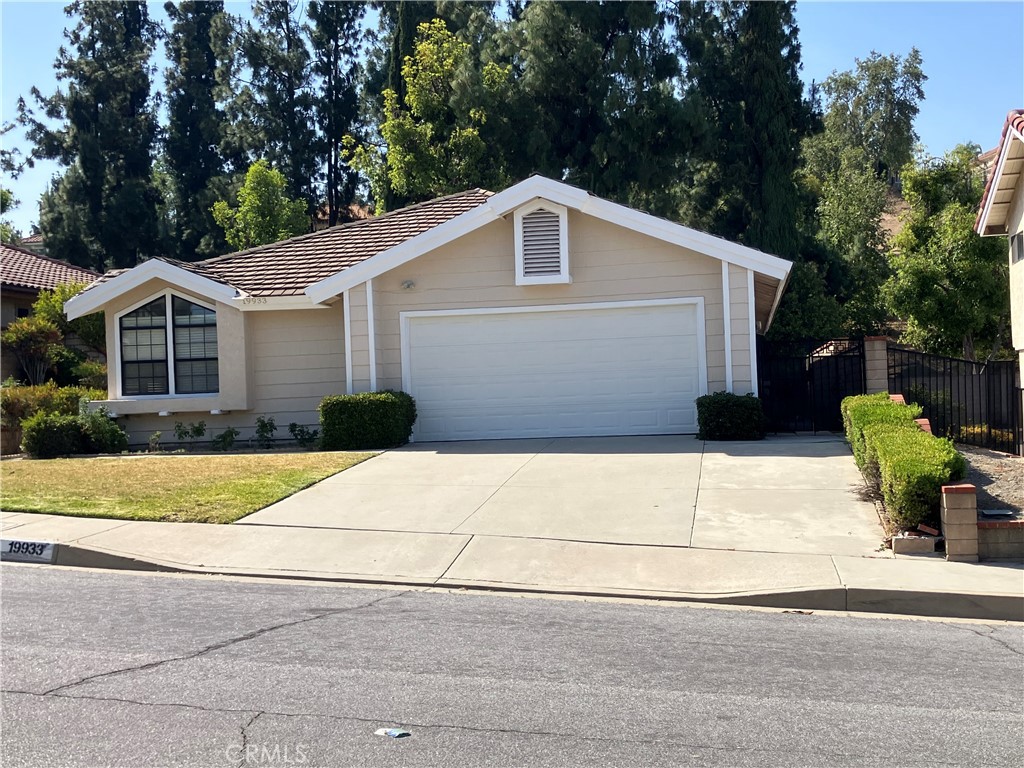19933 Ralph Street Walnut, CA 91789 - Photo 3 of 77 a front view of a house with a yard and garage