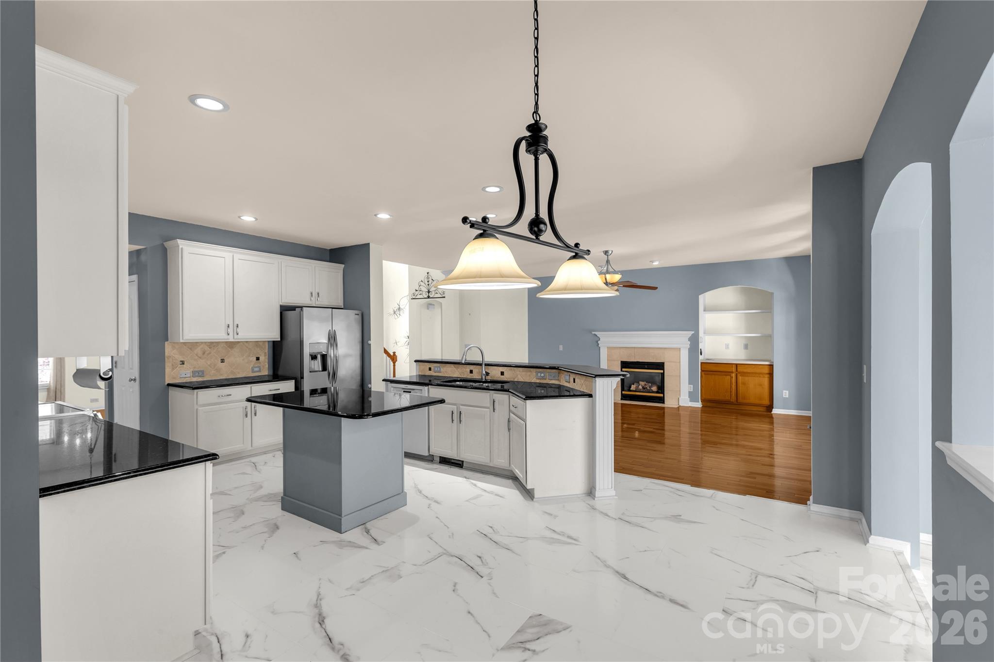 1644 Spandril Lane Fort Mill, SC 29708 - Photo 12 of 32 a kitchen with a refrigerator a stove top oven a sink and dishwasher