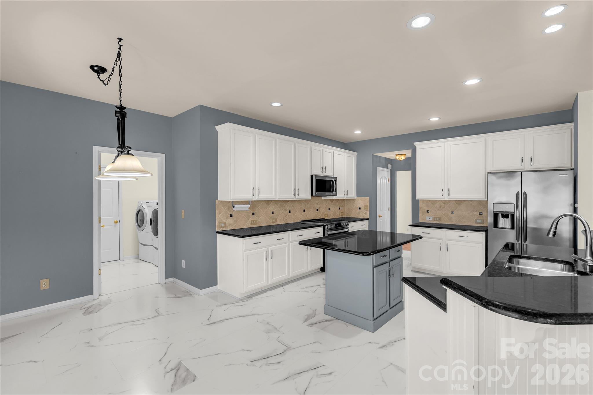 1644 Spandril Lane Fort Mill, SC 29708 - Photo 13 of 32 a kitchen with a sink and white cabinets