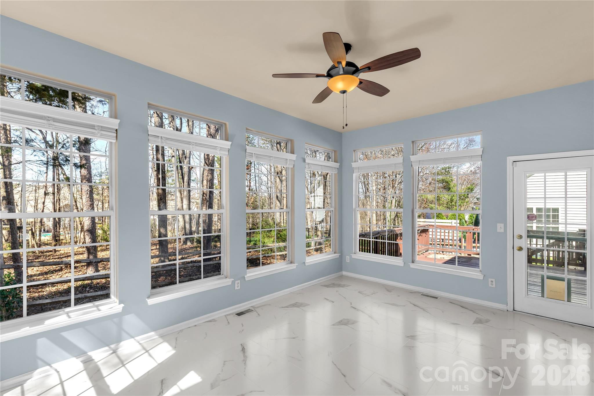 1644 Spandril Lane Fort Mill, SC 29708 - Photo 15 of 32 a view of a livingroom with furniture ceiling fan and windows