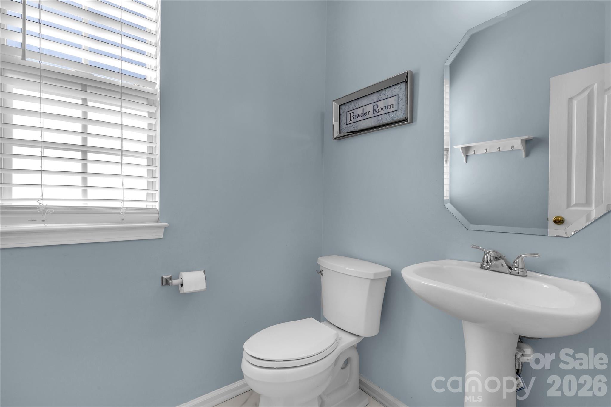 1644 Spandril Lane Fort Mill, SC 29708 - Photo 17 of 32 a bathroom with a toilet sink and mirror