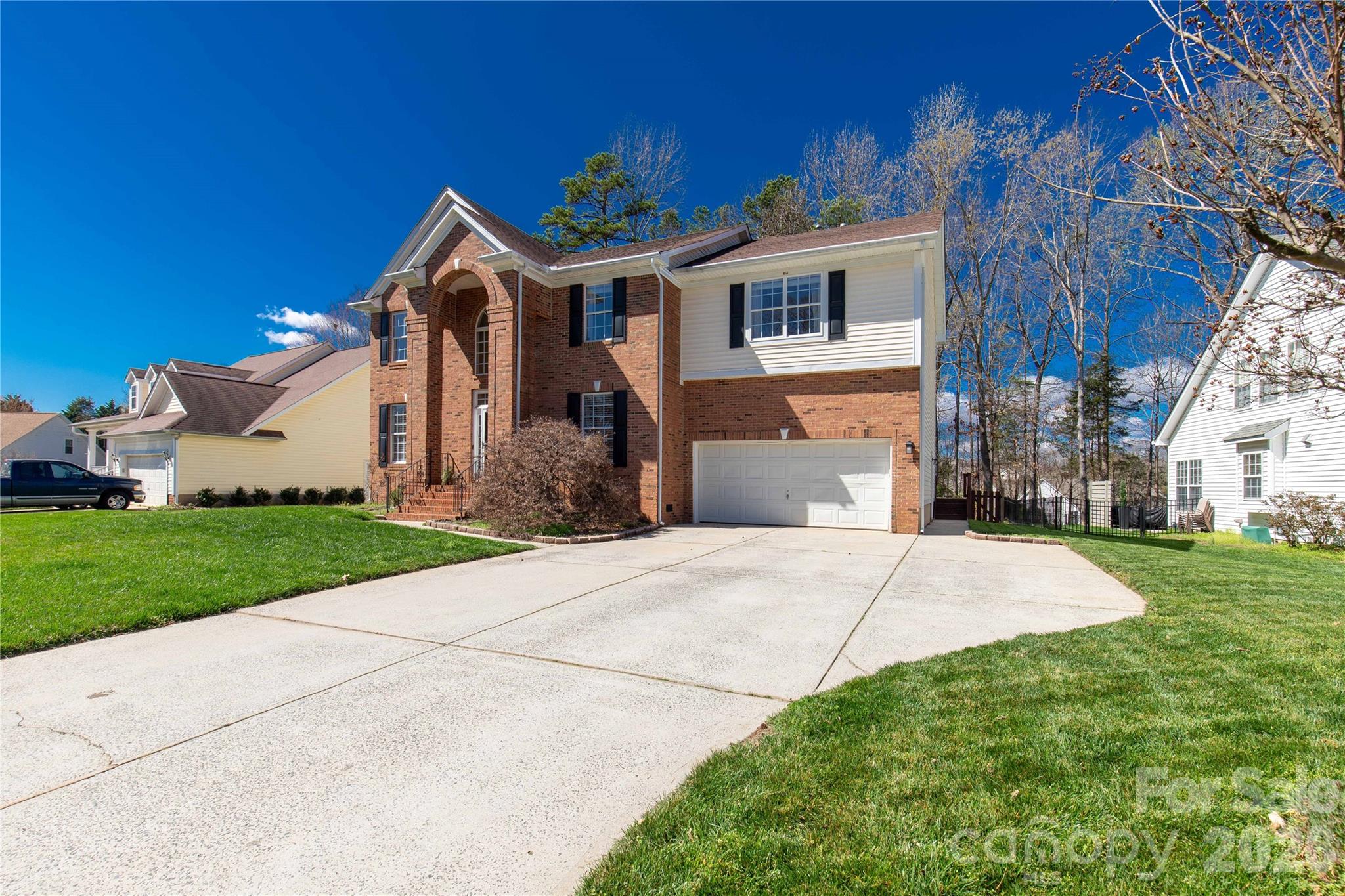 1644 Spandril Lane Fort Mill, SC 29708 - Photo 2 of 32 a front view of a house with a yard and garage