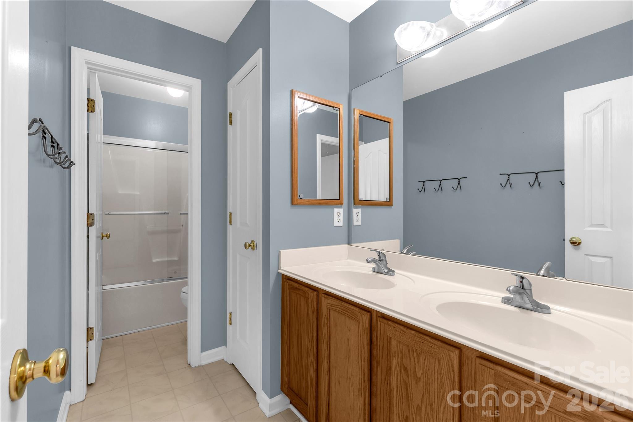 1644 Spandril Lane Fort Mill, SC 29708 - Photo 23 of 32 a bathroom with a double vanity sink mirror and shower