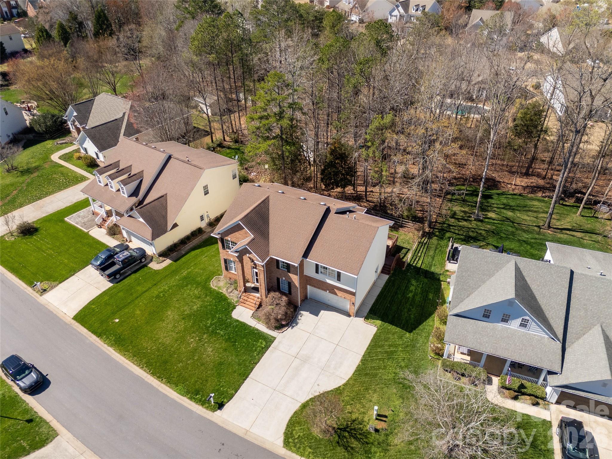 1644 Spandril Lane Fort Mill, SC 29708 - Photo 3 of 32 an aerial view of a house with garden space and street view