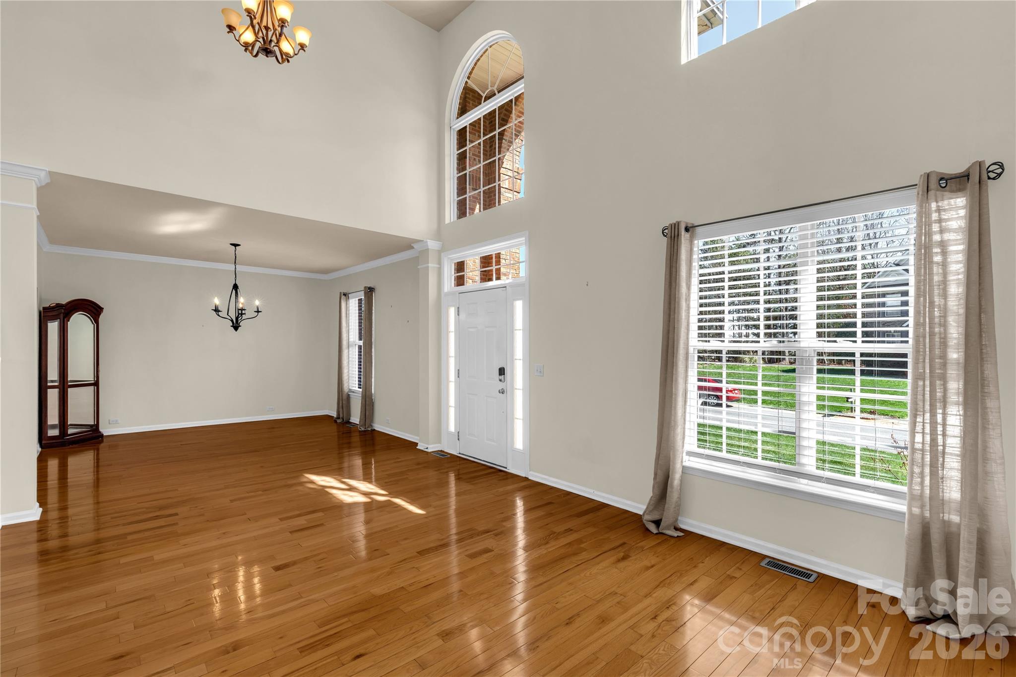 1644 Spandril Lane Fort Mill, SC 29708 - Photo 4 of 32 a view of an empty room with wooden floor and a window