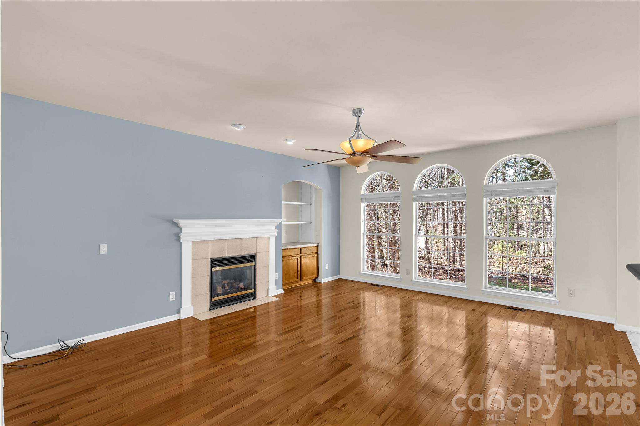 1644 Spandril Lane Fort Mill, SC 29708 - Photo 7 of 32 a view of an empty room with window and wooden floor