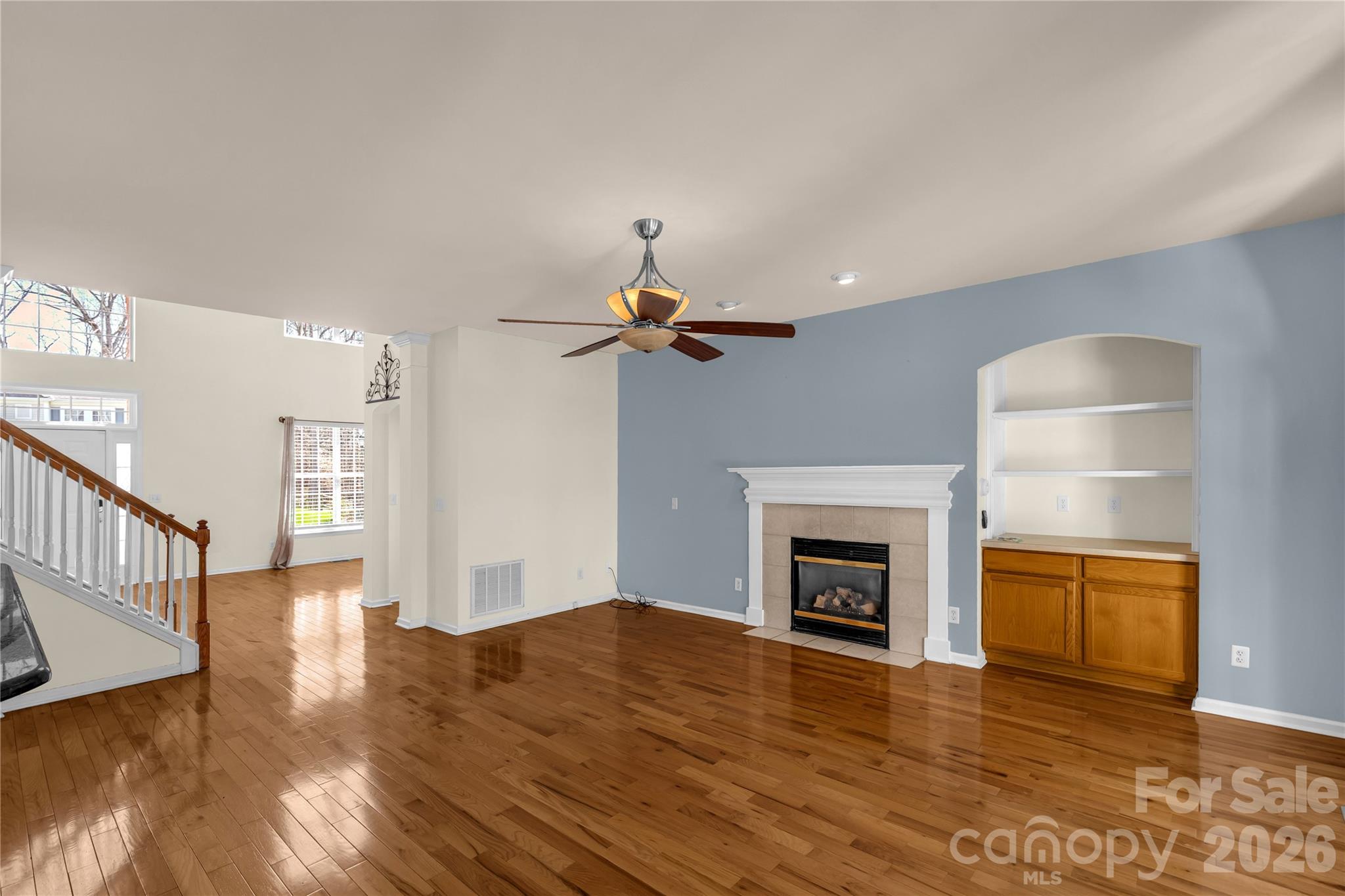 1644 Spandril Lane Fort Mill, SC 29708 - Photo 9 of 32 a view of empty room with wooden floor and fireplace