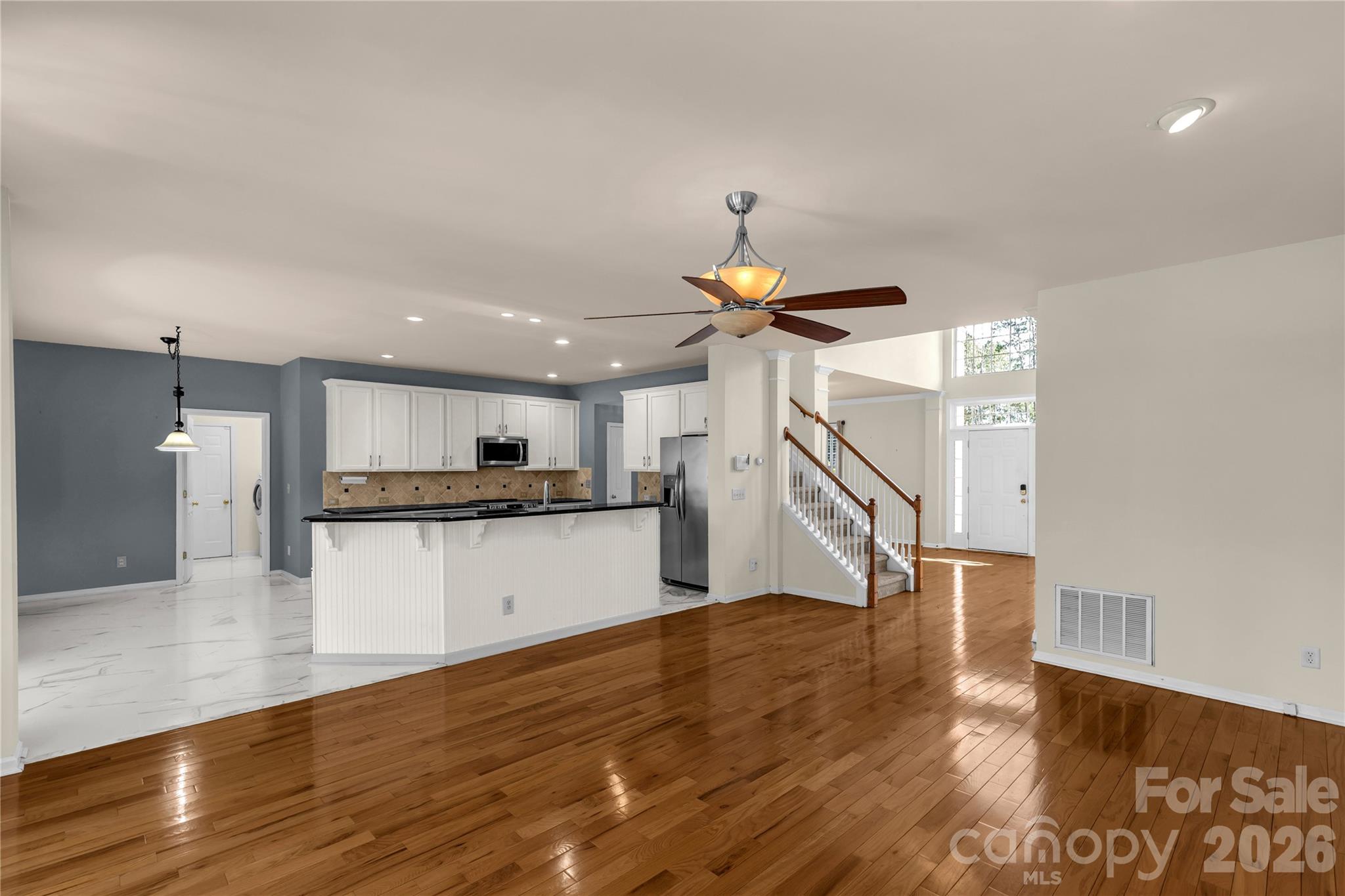 1644 Spandril Lane Fort Mill, SC 29708 - Photo 10 of 32 a view of kitchen with cabinets and wooden floor