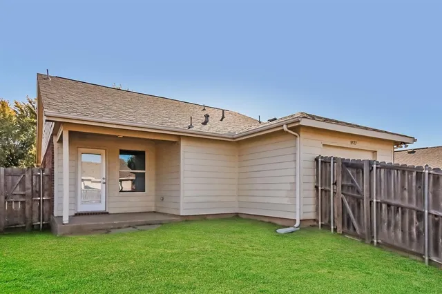a view of a backyard of the house