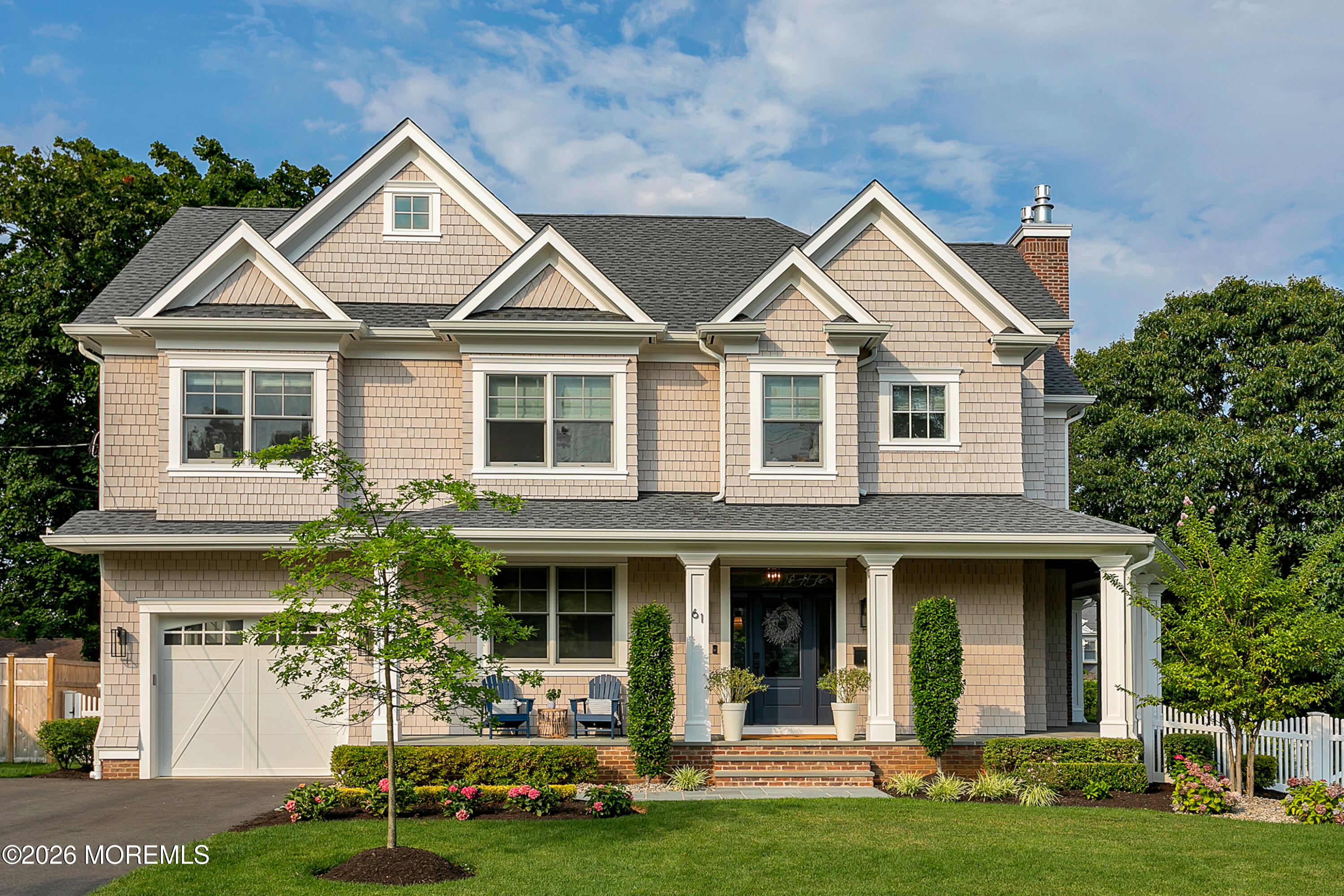 61 Center Street Rumson, NJ 07760 - Photo 1 of 30 a front view of a house with garden