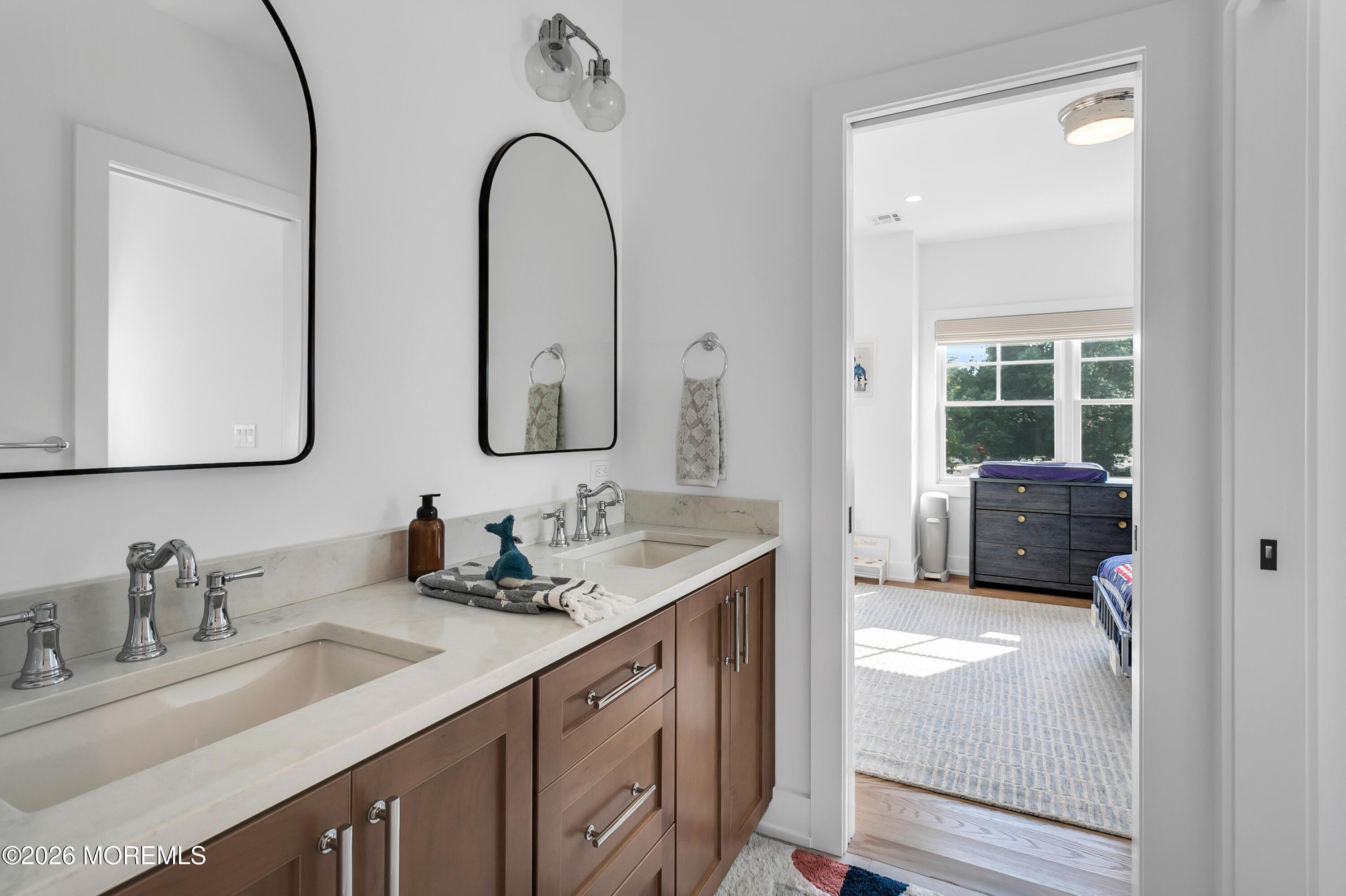 61 Center Street Rumson, NJ 07760 - Photo 20 of 30 a en suite bathroom with a double vanity sink and mirror