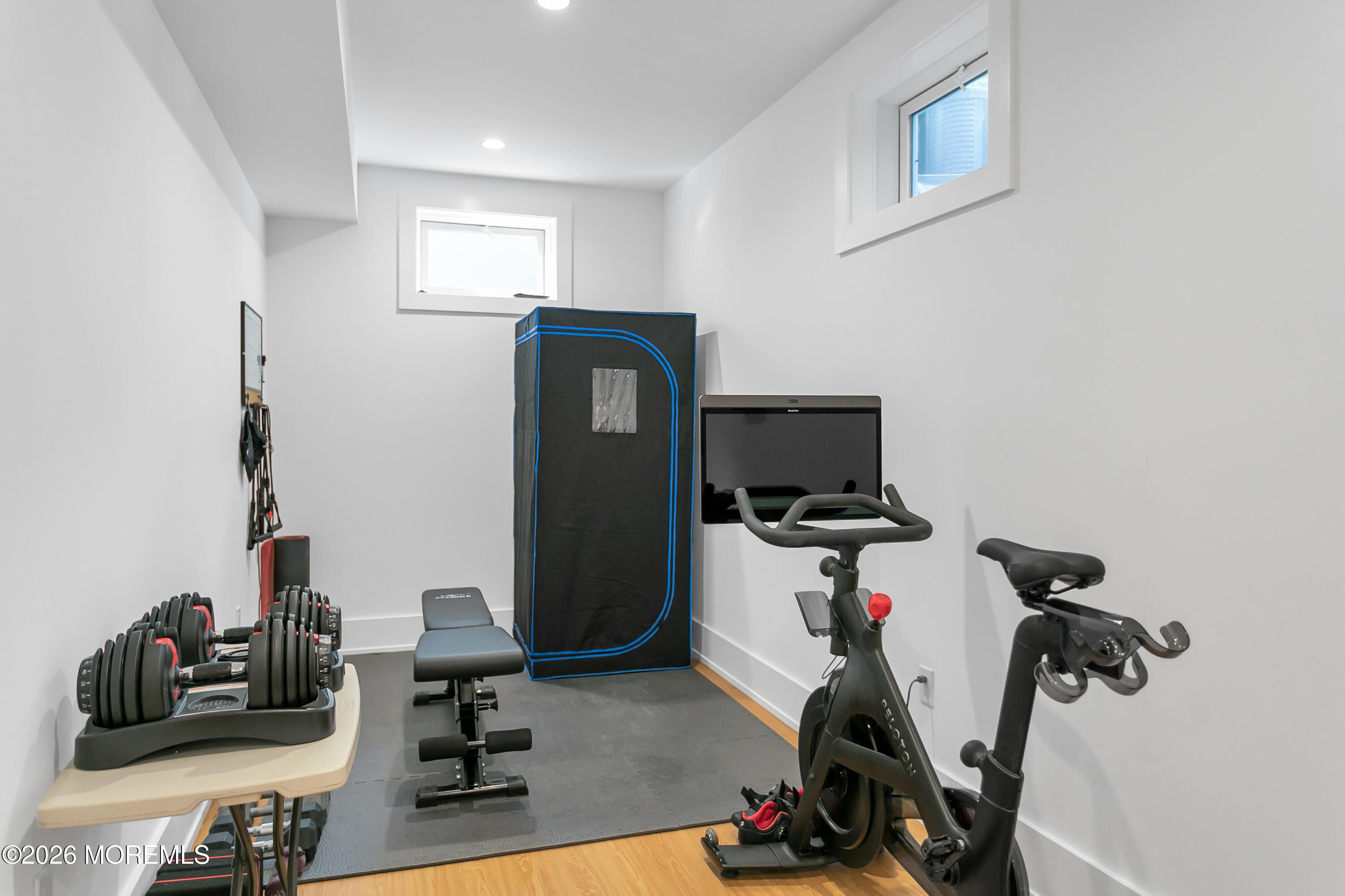 61 Center Street Rumson, NJ 07760 - Photo 28 of 30 a room with gym equipment and wooden floor