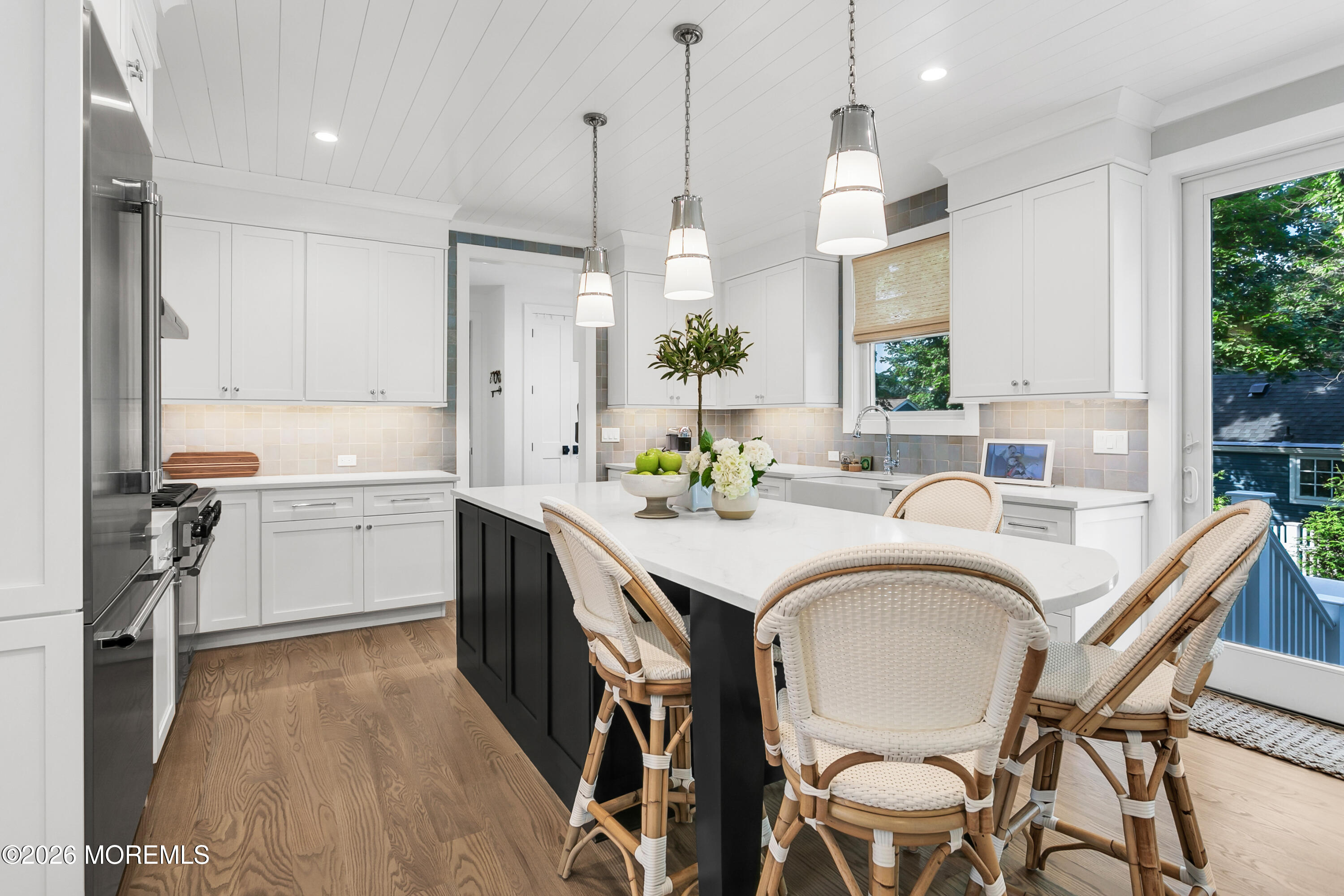 61 Center Street Rumson, NJ 07760 - Photo 4 of 30 a large white kitchen with sink a refrigerator and furniture