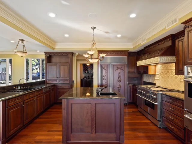 a spacious bedroom with a large bed and a large window