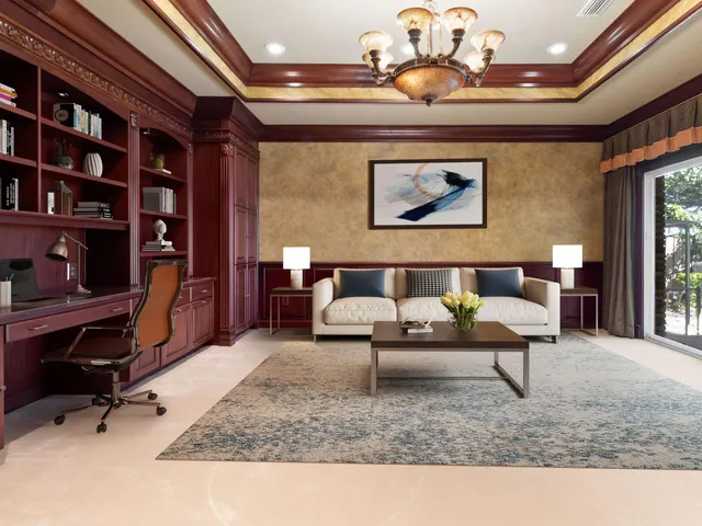 an empty room with windows and fireplace