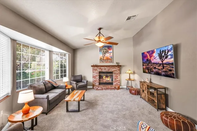 an aerial view of a house with a yard and garden