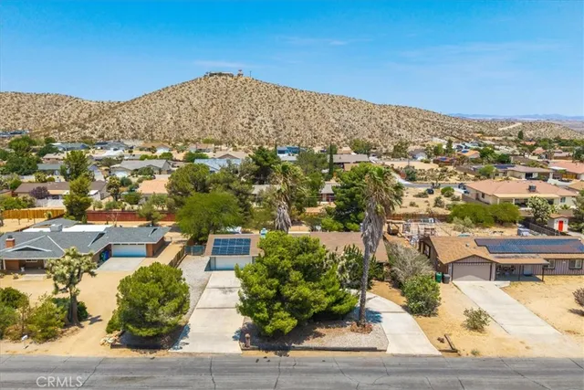 an aerial view of residential houses and outdoor space