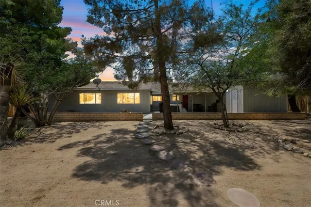 a view of a house with a tree